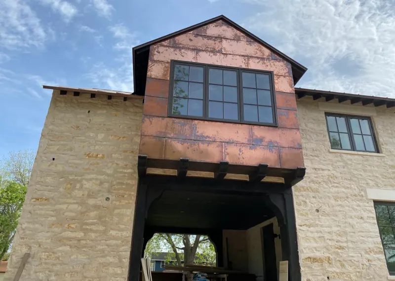 Copper metal panel facade on a stone building for Roof Repair in Sierra Vista